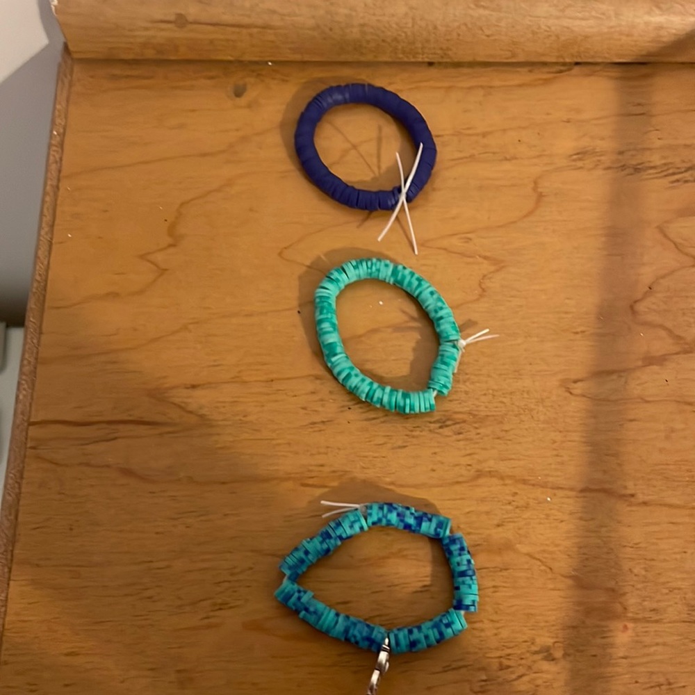 Set of teal and purple bracelets with sliver owl charm
